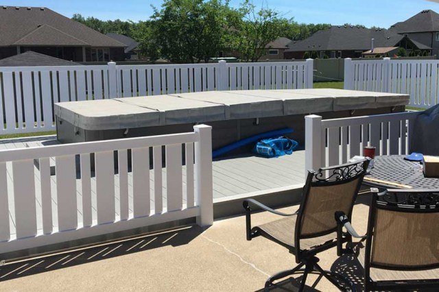 vinyl fencing surrounding outdoor above ground pool