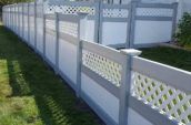 cypress pvc vinyl fence with decorative elements attached to home