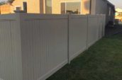 modern home with backyard surrounded by pvc vinyl privacy fence